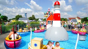 A water park with various colorful boats and a lighthouse structure. - Holiday Inn Express Southampton - West by IHG (Southampton)