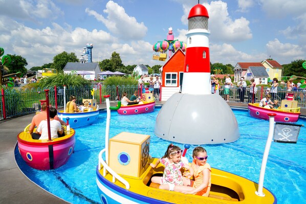 A water park with various colorful boats and a lighthouse structure. - Holiday Inn Express Southampton - West by IHG (Southampton)