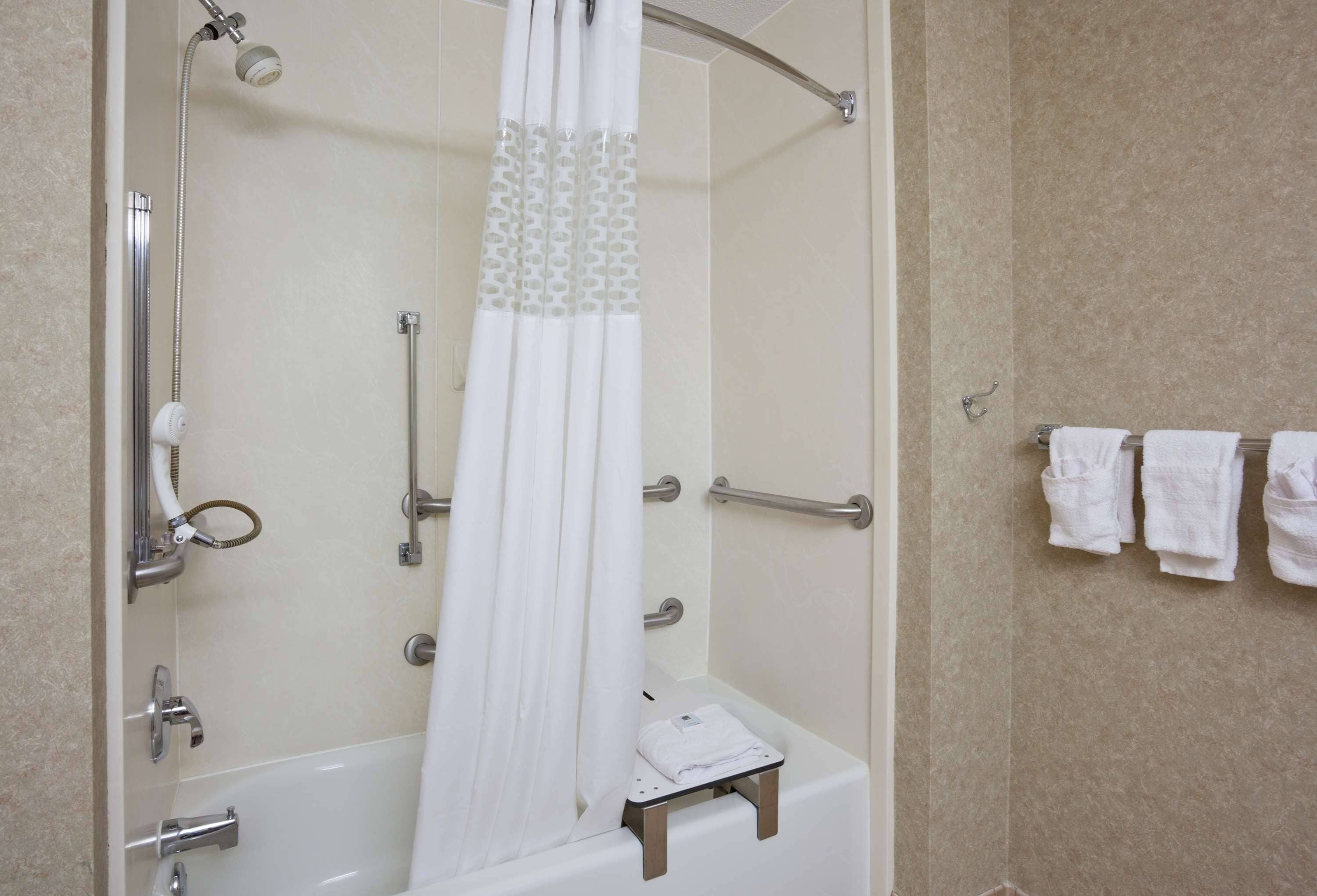 rainfall showerhead, designer toiletries, hair dryer, towels