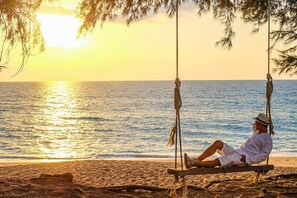 Private beach, white sand, sun loungers, windsurfing