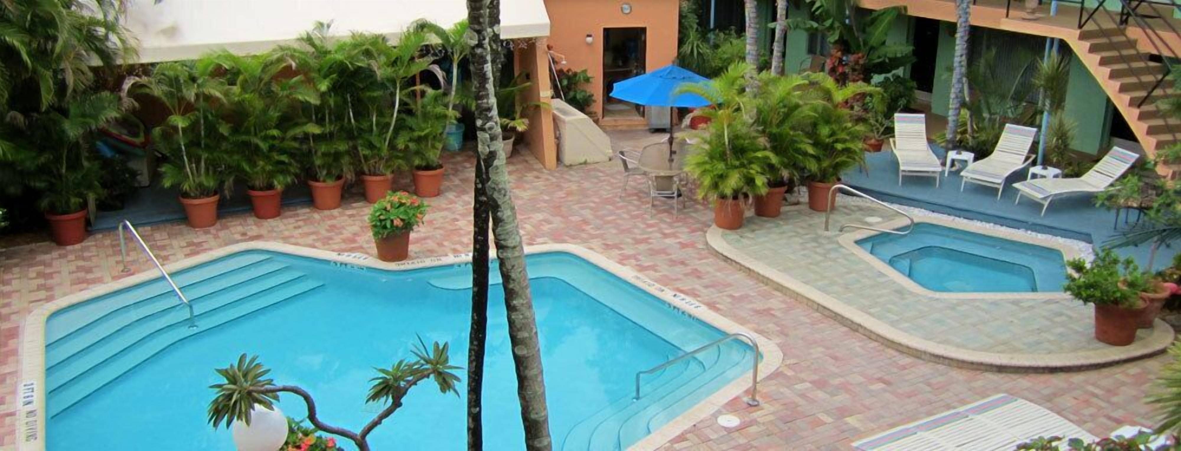 outdoor pool, pool umbrellas, pool loungers