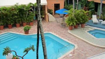 Outdoor pool, pool umbrellas, sun loungers