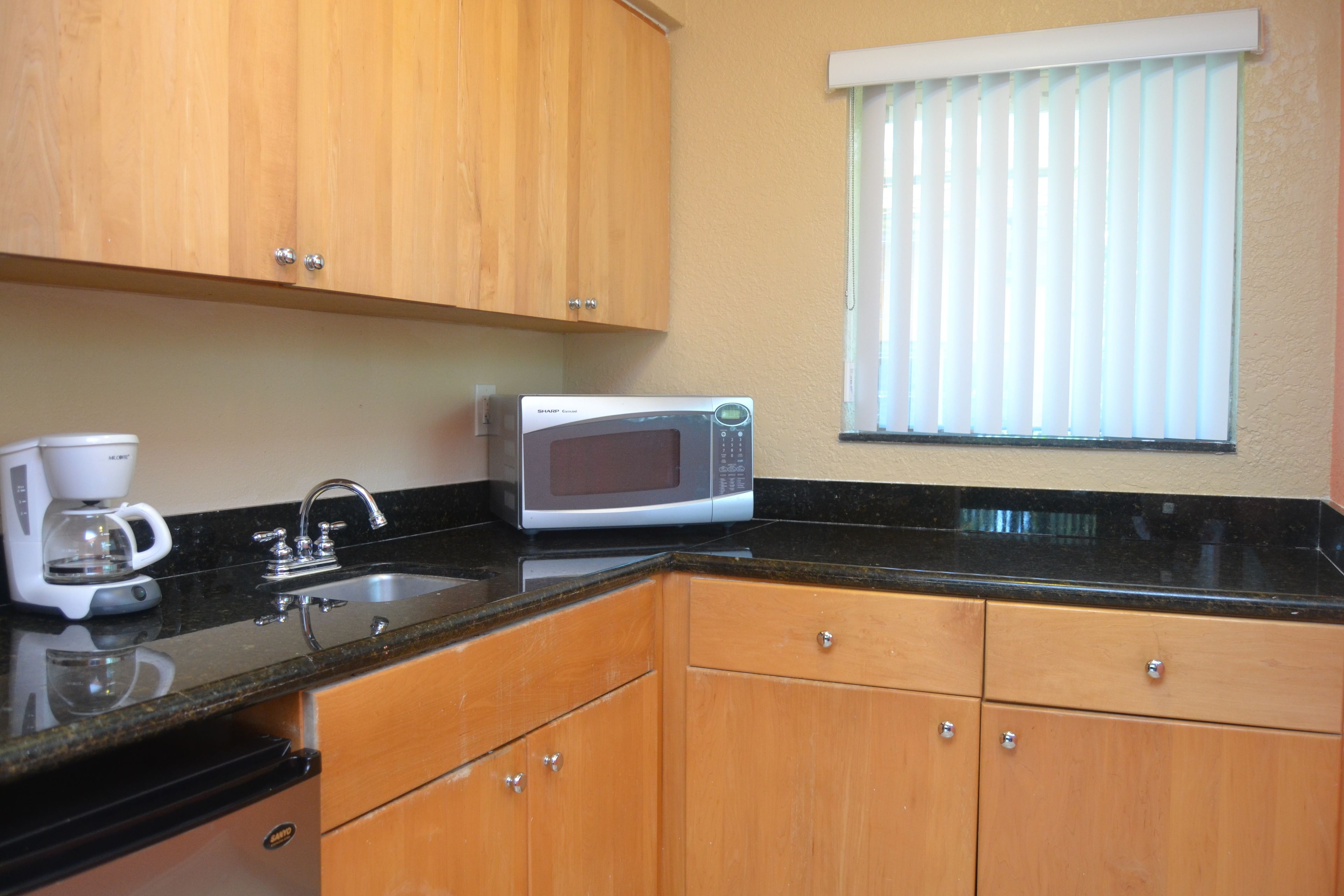 suite, 1 king bed, corner | private kitchen | mini-fridge, microwave, coffee/tea maker, toaster