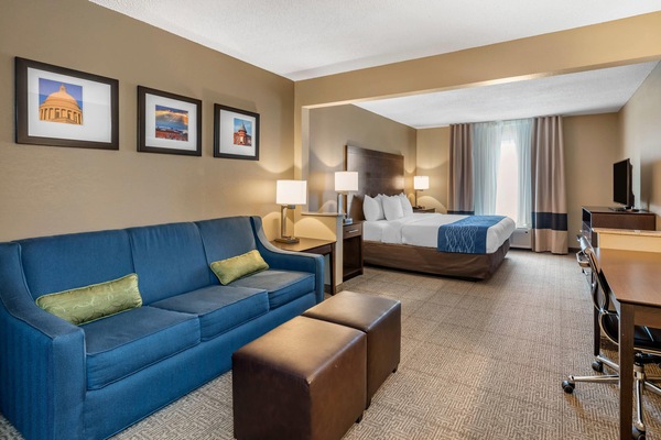 Premium bedding, desk, laptop workspace, blackout drapes