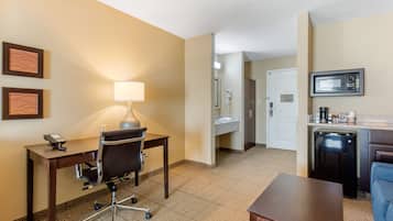 Premium bedding, desk, laptop workspace, blackout drapes