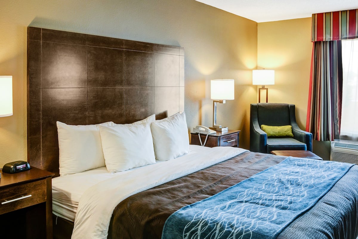 premium bedding, desk, laptop workspace, blackout curtains