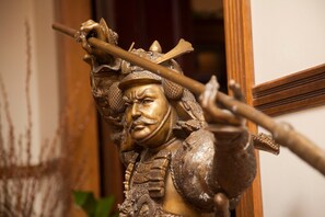 A statue of a historical figure holding a staff.
