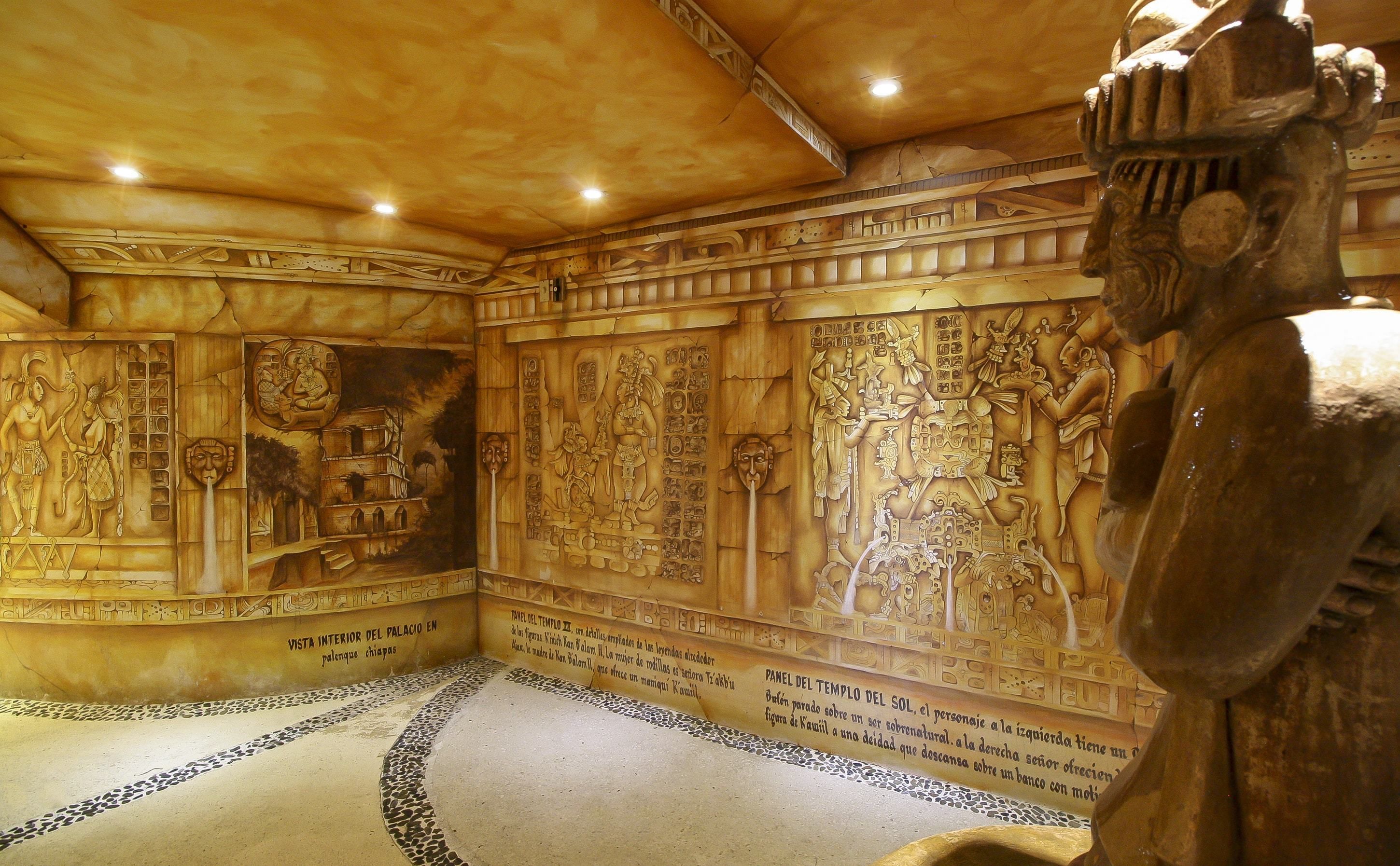 An interior with detailed carvings and a large statue.