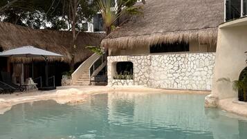 Outdoor pool, open 8:00 AM to 8:00 PM, free pool cabanas