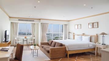 Deluxe Studio, River View | Minibar, in-room safe, desk, blackout drapes