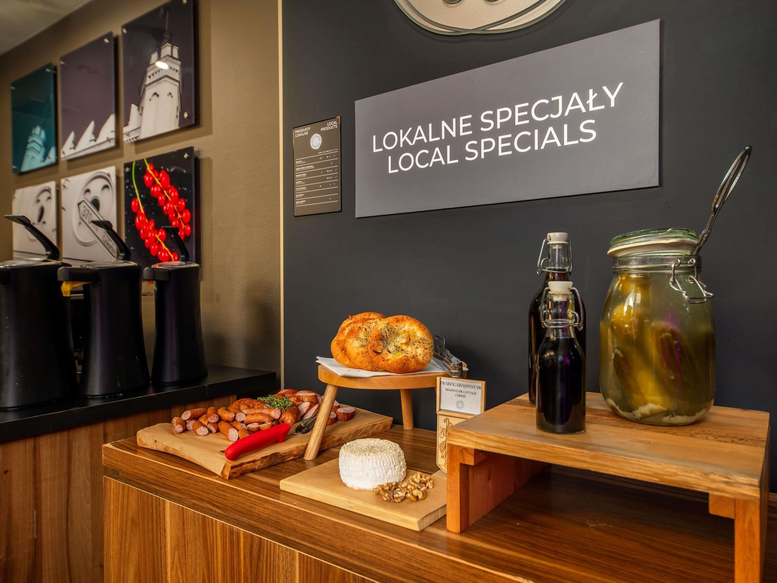 A counter with local specialties including bread, cheese, and pickled vegetables.