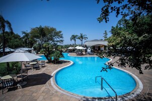 Outdoor pool, pool umbrellas, sun loungers