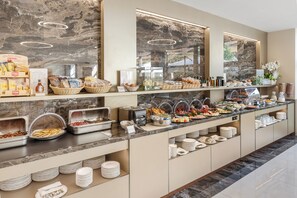 A buffet setup with various food items and gluten-free options. - Art Hotel Navigli (Milan)