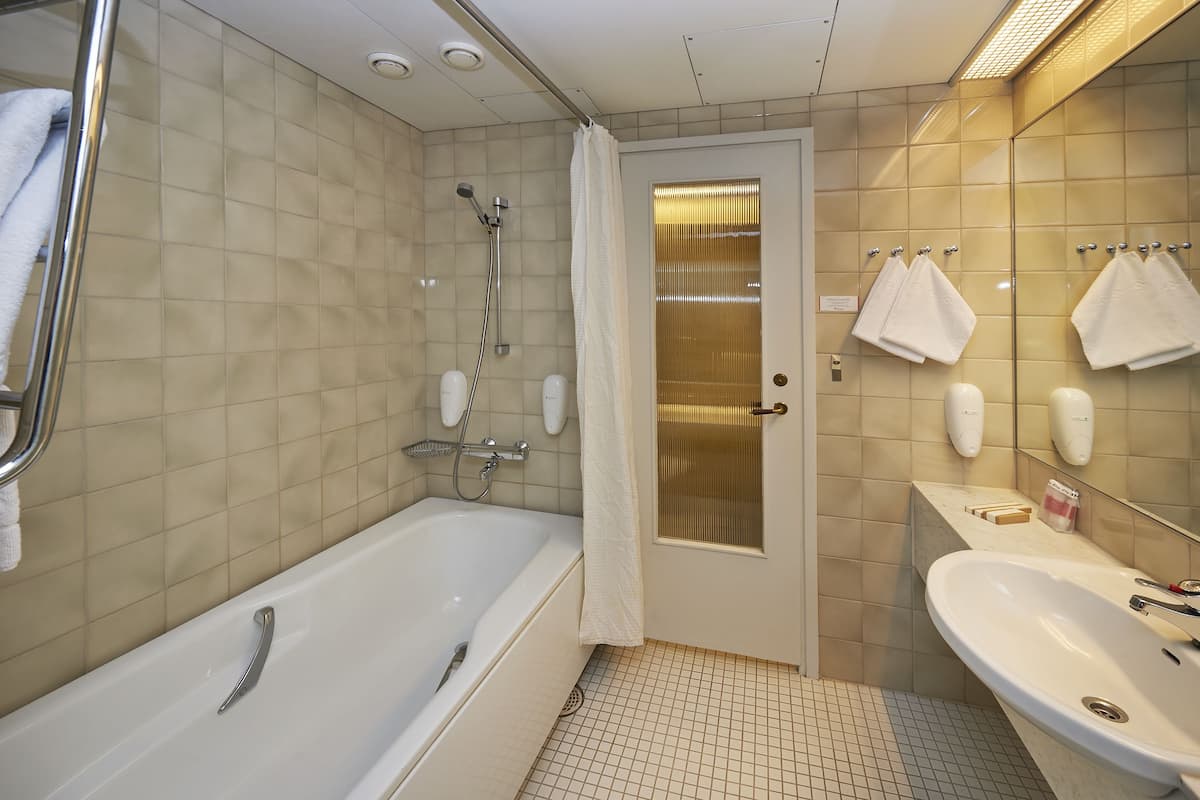 superior twin room (large, linna building) | bathroom | hair dryer, towels