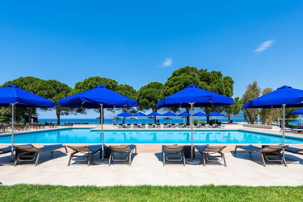 Seasonal outdoor pool, open 11:00 AM to 7:00 PM, pool umbrellas