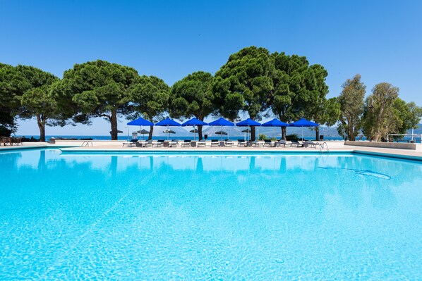 Seasonal outdoor pool, open 11:00 AM to 7:00 PM, pool umbrellas