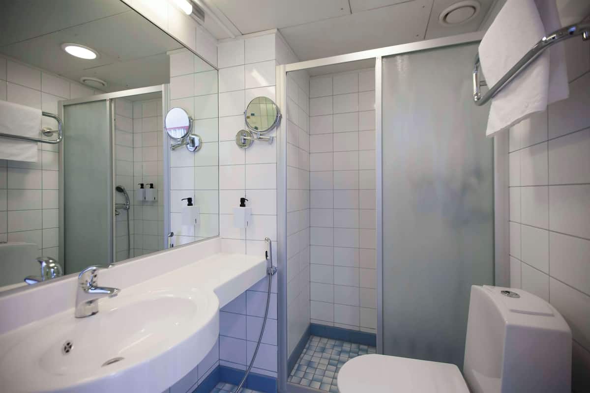 twin room | minibar, in-room safe, desk, blackout curtains