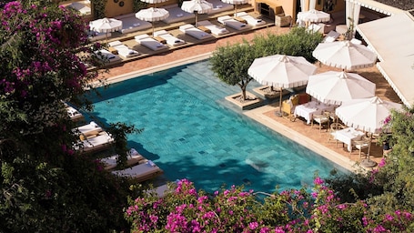 Indoor pool, outdoor pool, free pool cabanas, pool umbrellas