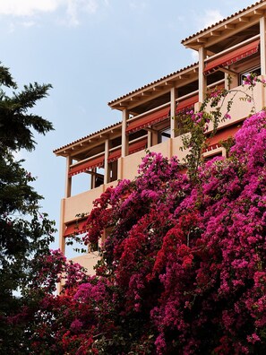 A building with a balcony and a view of pink bougainvillea flowers. - The Margi (Vari-Voula-Vouliagmeni)