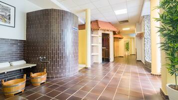 Comfortable indoor space with a tiled floor, framed picture, and potted plant.