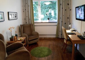 Deluxe Double Room, Garden View | Individually decorated, desk, blackout drapes, iron/ironing board - First Hotel Linné (Uppsala)