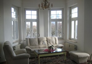 Triple Room | Living area | 65-cm flat-screen TV with satellite channels, TV, pay movies