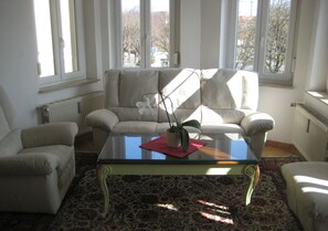 Triple Room | Living area | 65-cm flat-screen TV with satellite channels, TV, pay movies