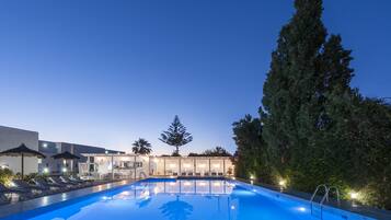 Outdoor pool, open 11:00 AM to 7:00 PM, pool umbrellas, pool loungers