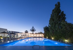 Outdoor pool, open 11:00 AM to 7:00 PM, pool umbrellas, pool loungers