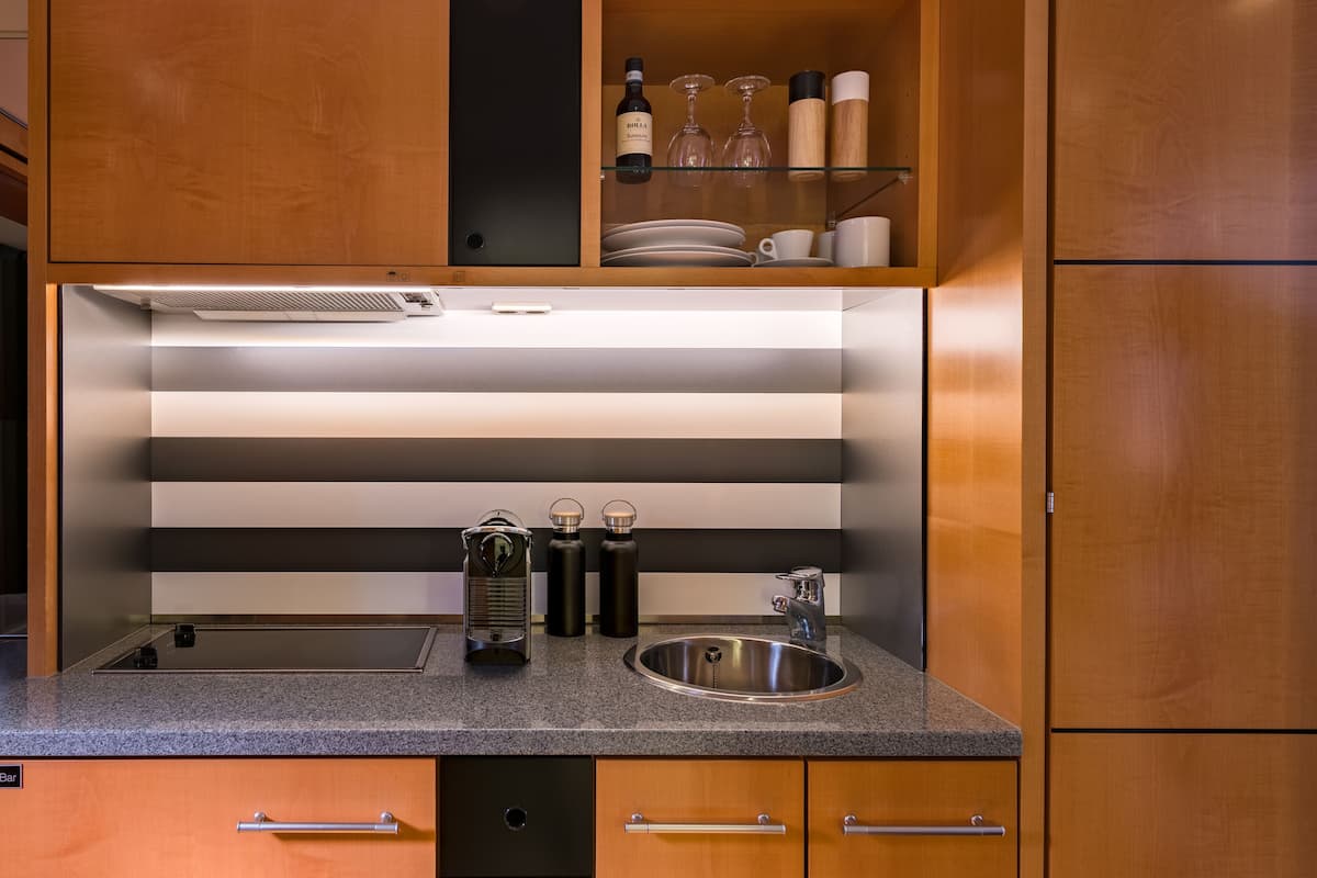 full-sized fridge, microwave, stovetop, espresso maker