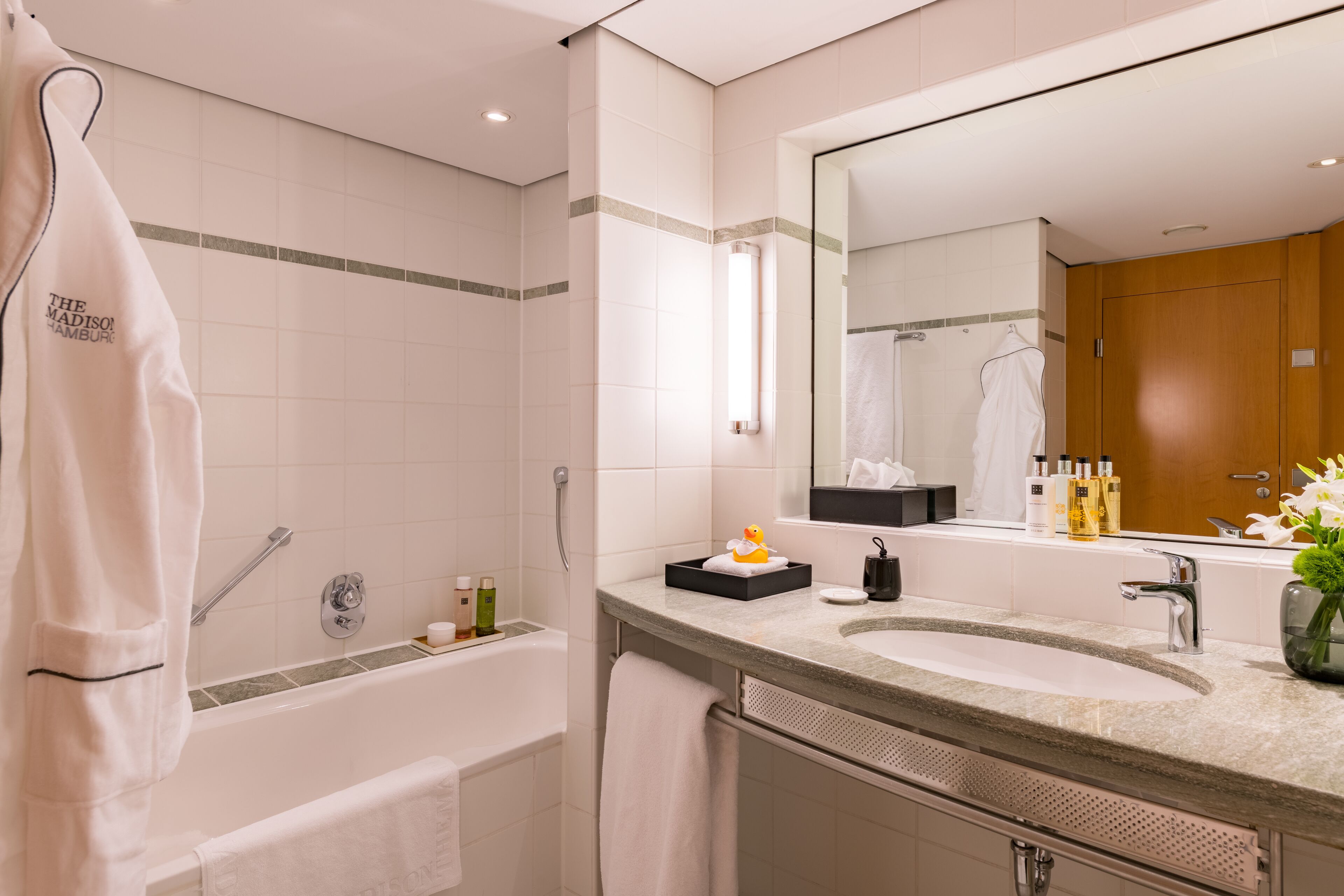 designer toiletries, hair dryer, bathrobes, towels