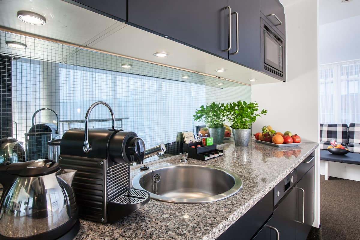 full-sized fridge, microwave, stovetop, espresso maker