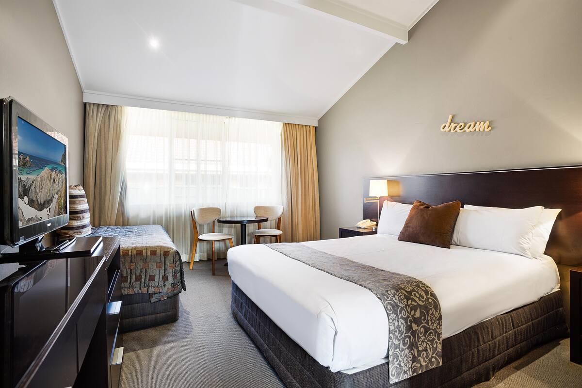 Premier Room, Multiple Beds, Non Smoking | Minibar, laptop workspace, blackout curtains, iron/ironing board