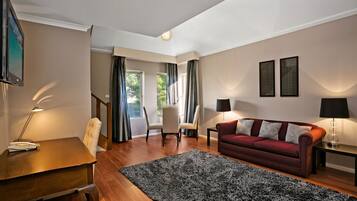 Suite, 1 Queen Bed, Non Smoking, Mezzanine | Living room | 32-inch LCD TV with digital channels, TV