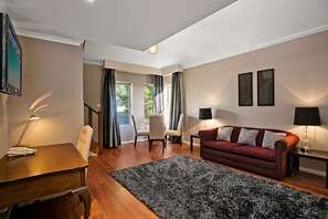 Suite, 1 Queen Bed, Non Smoking, Mezzanine | Living room | 32-inch LCD TV with digital channels, TV