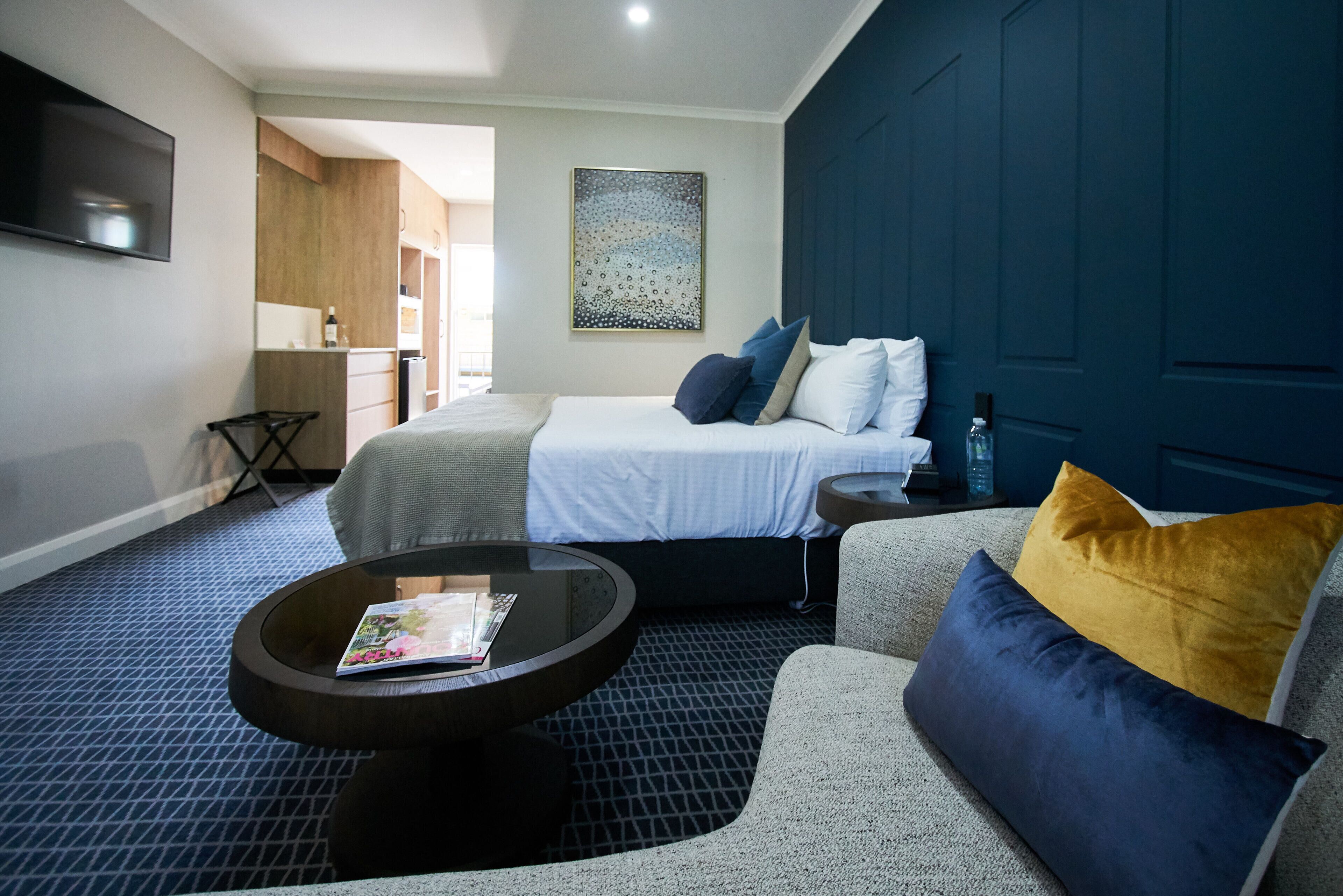 executive queen room | desk, laptop workspace, blackout curtains, soundproofing