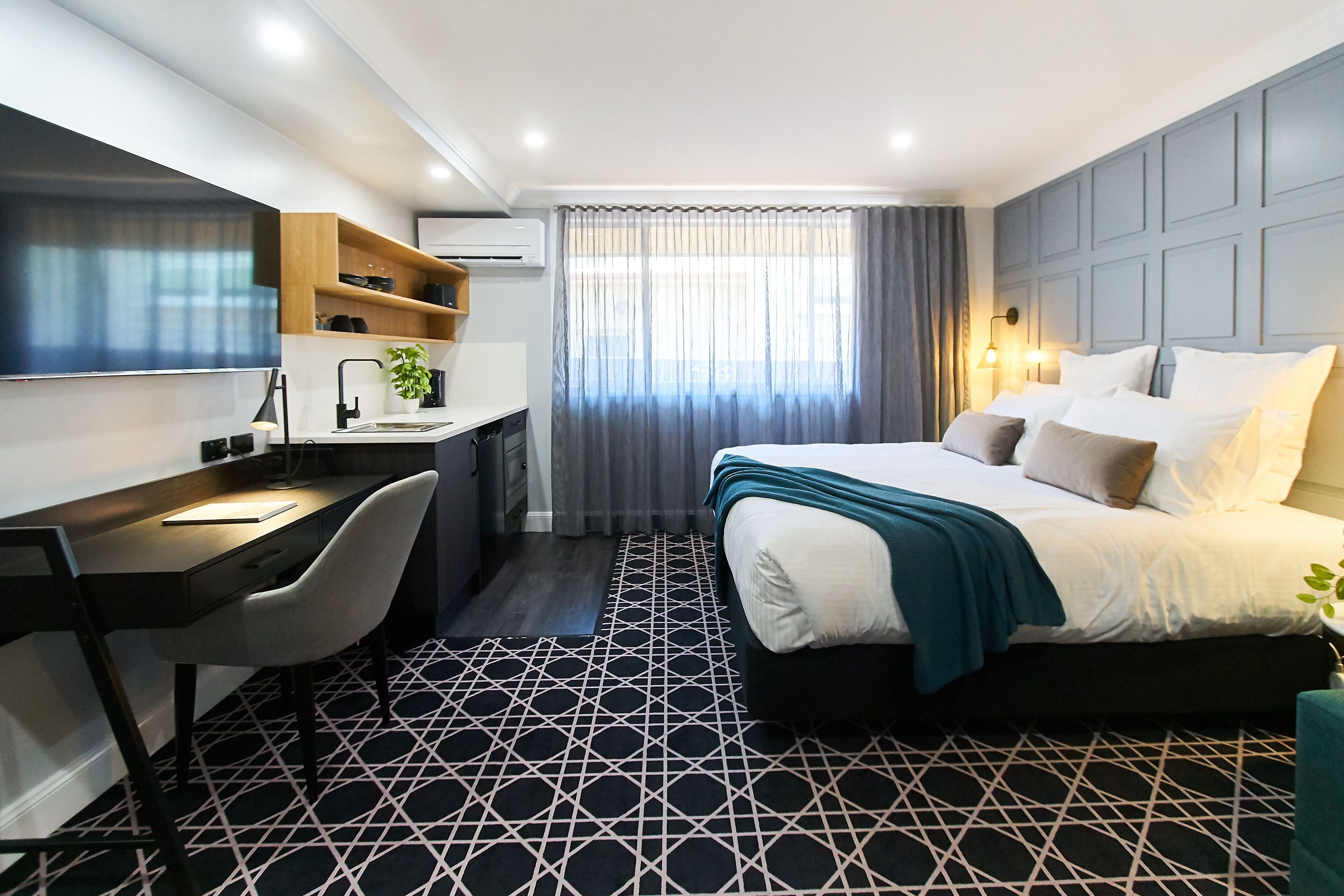 king suite with kitchenette | desk, laptop workspace, blackout curtains, soundproofing