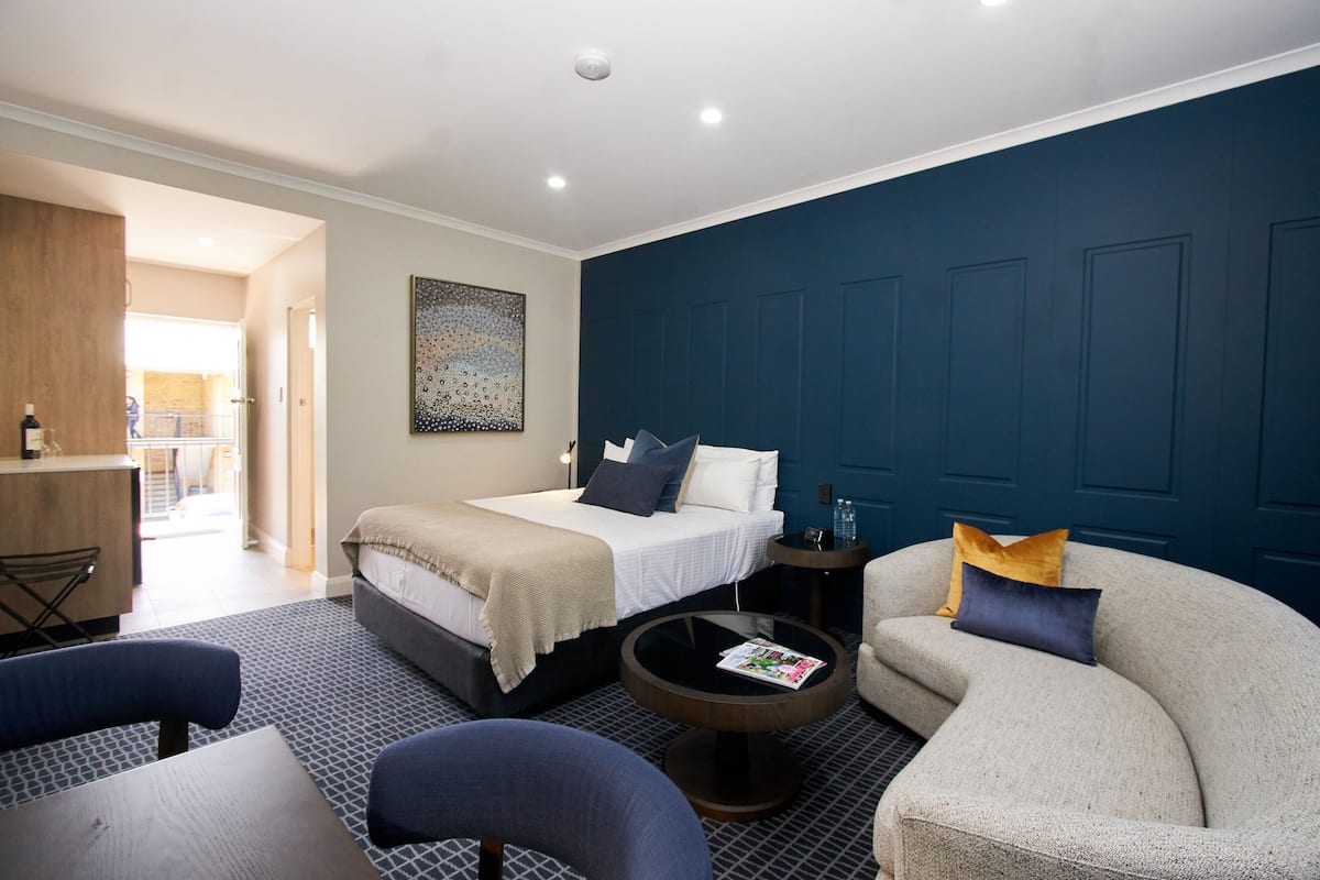 executive queen room | desk, laptop workspace, blackout curtains, soundproofing