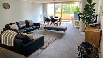 2 Bedroom Family Apartment | Living area | 55-inch Smart TV with cable channels