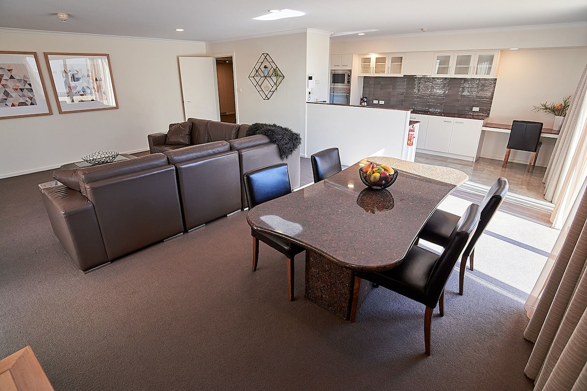 2 Bedroom Deluxe Apartment | Living room | 55-inch Smart TV with cable channels