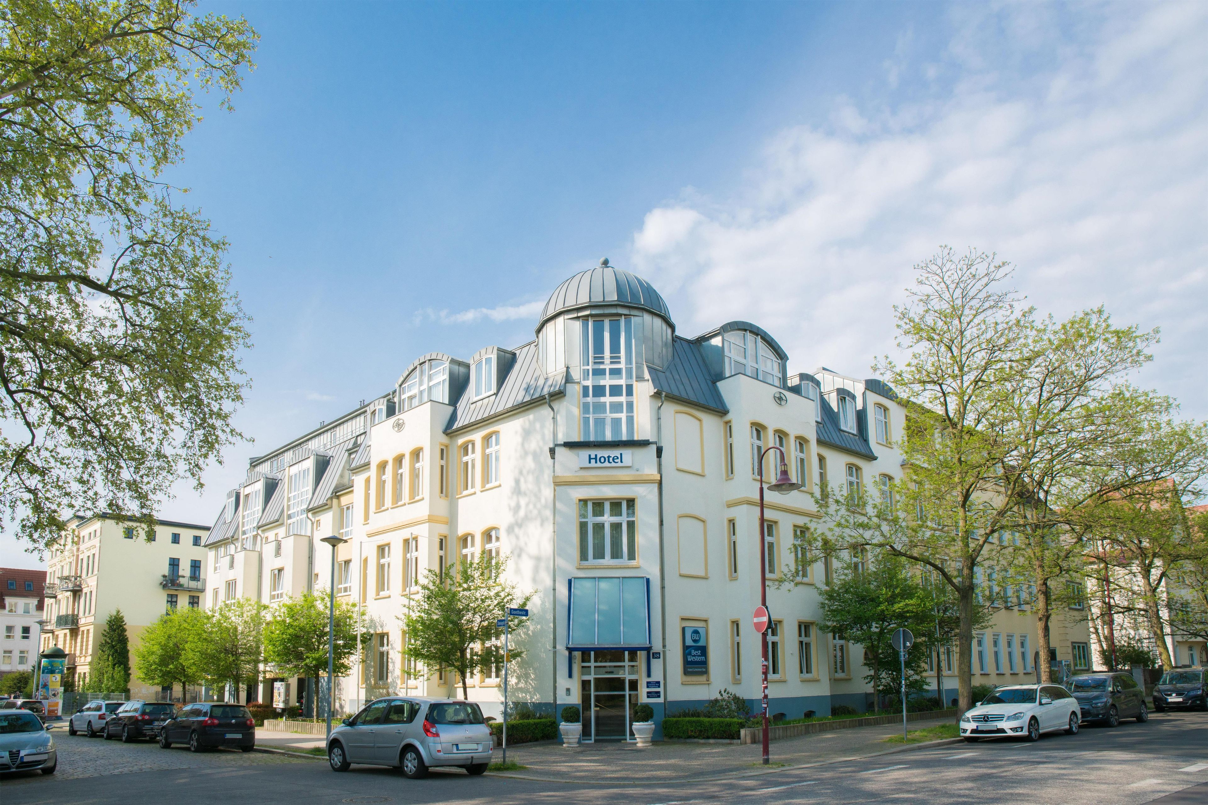 A hotel with a classic architectural style, featuring a prominent dome and multiple windows.