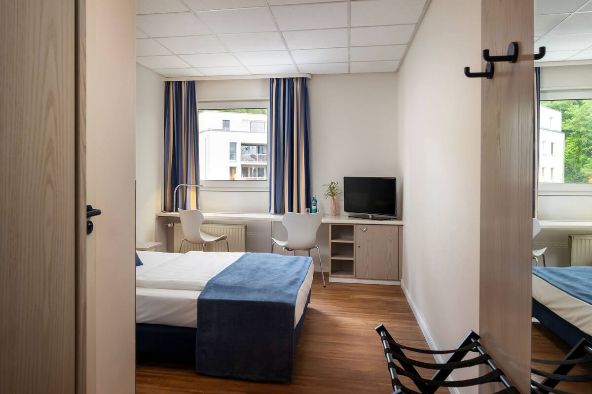 Desk, blackout drapes, iron/ironing board (on request), WiFi (free)