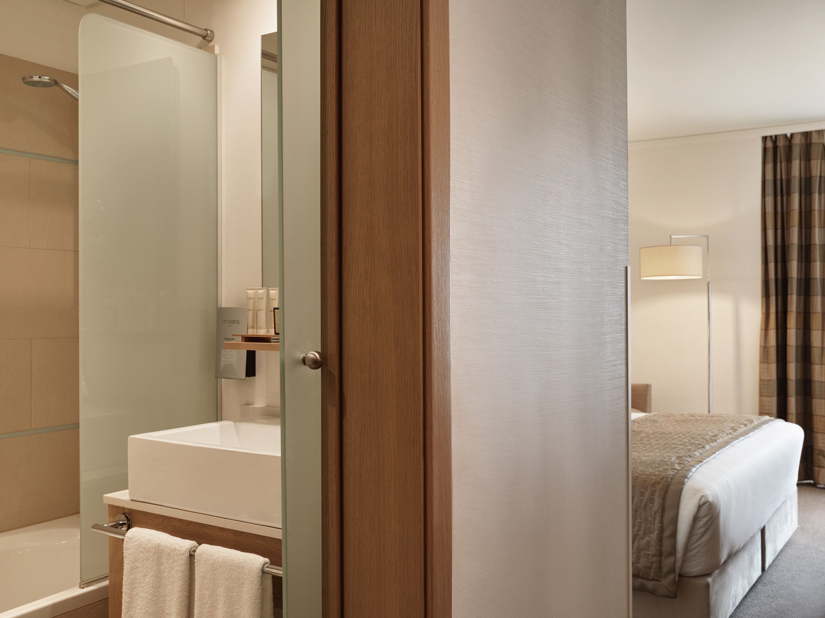 designer toiletries, hair dryer, bathrobes, slippers