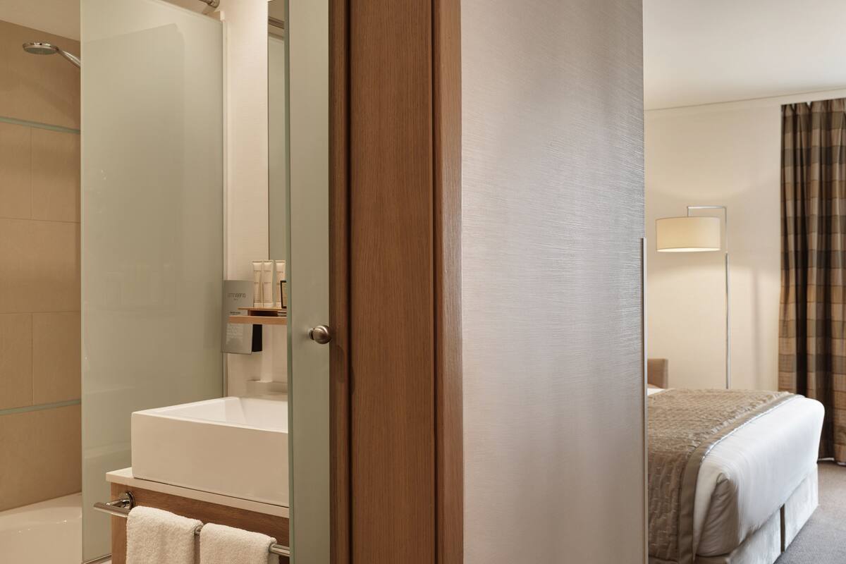 designer toiletries, hair dryer, bathrobes, slippers