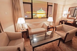 Standard Twin Room | Living room | 21-inch LCD TV with cable channels, TV