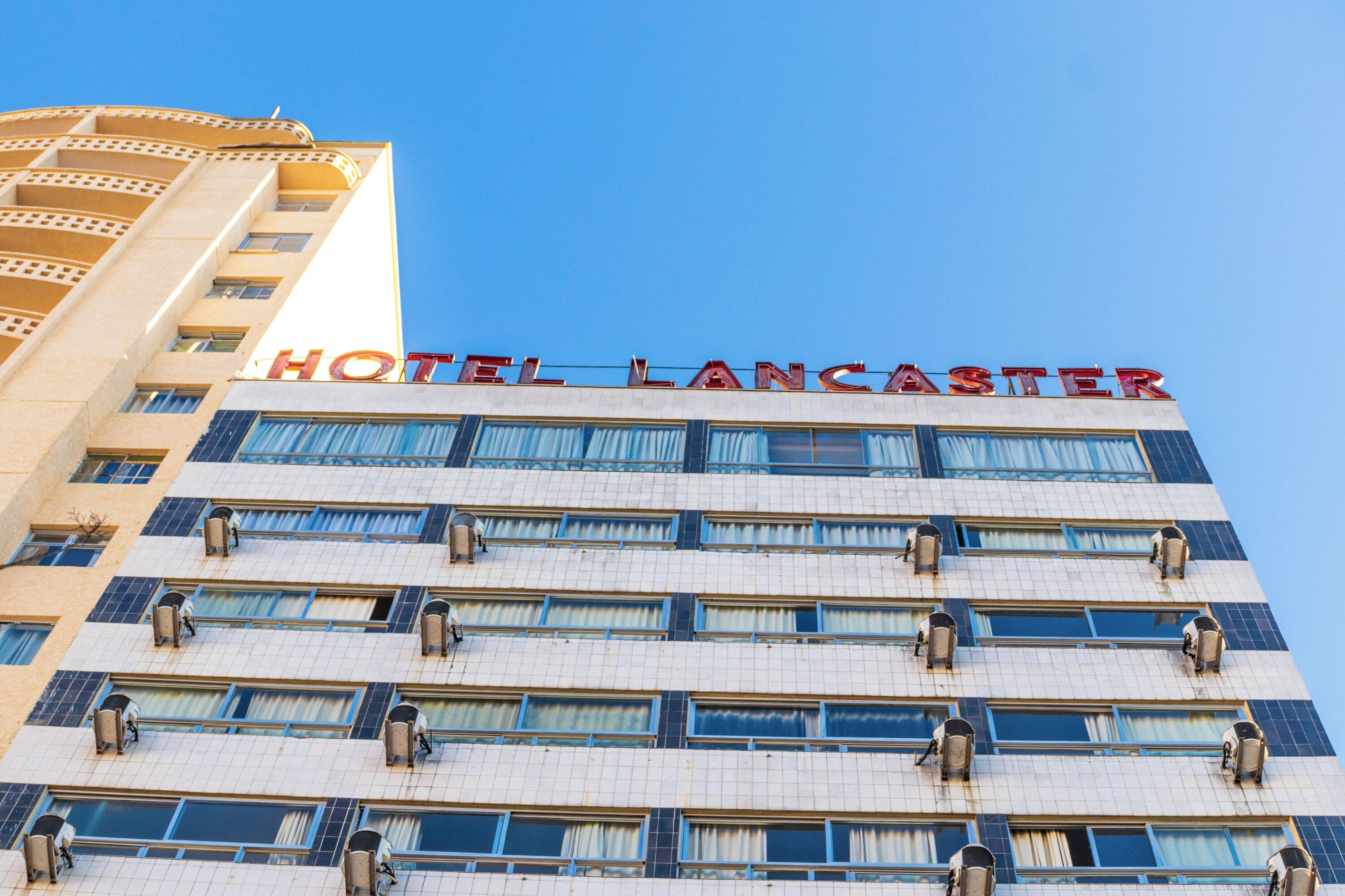 A hotel building with the name "HOTEL LANCASHER" prominently displayed at the top.