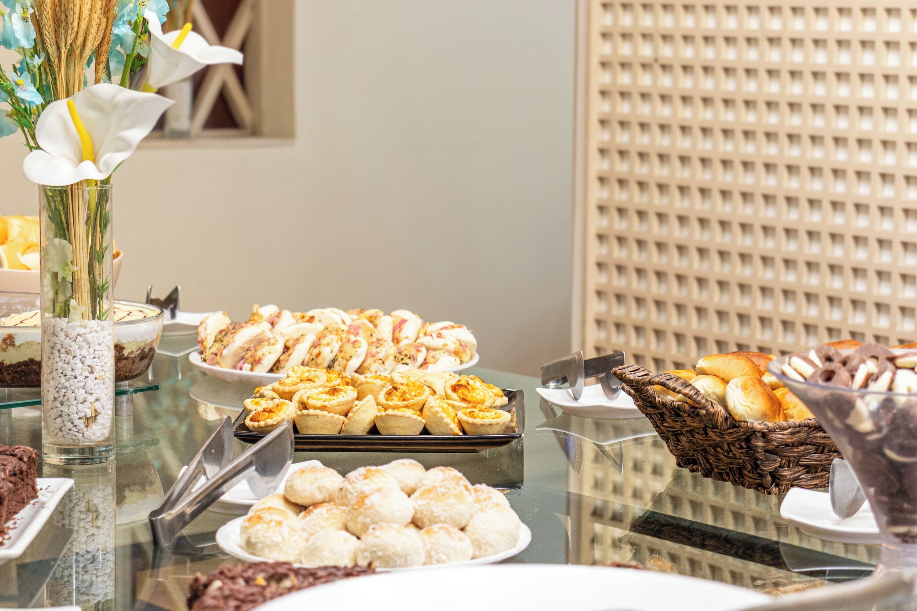 A buffet with various pastries and desserts.