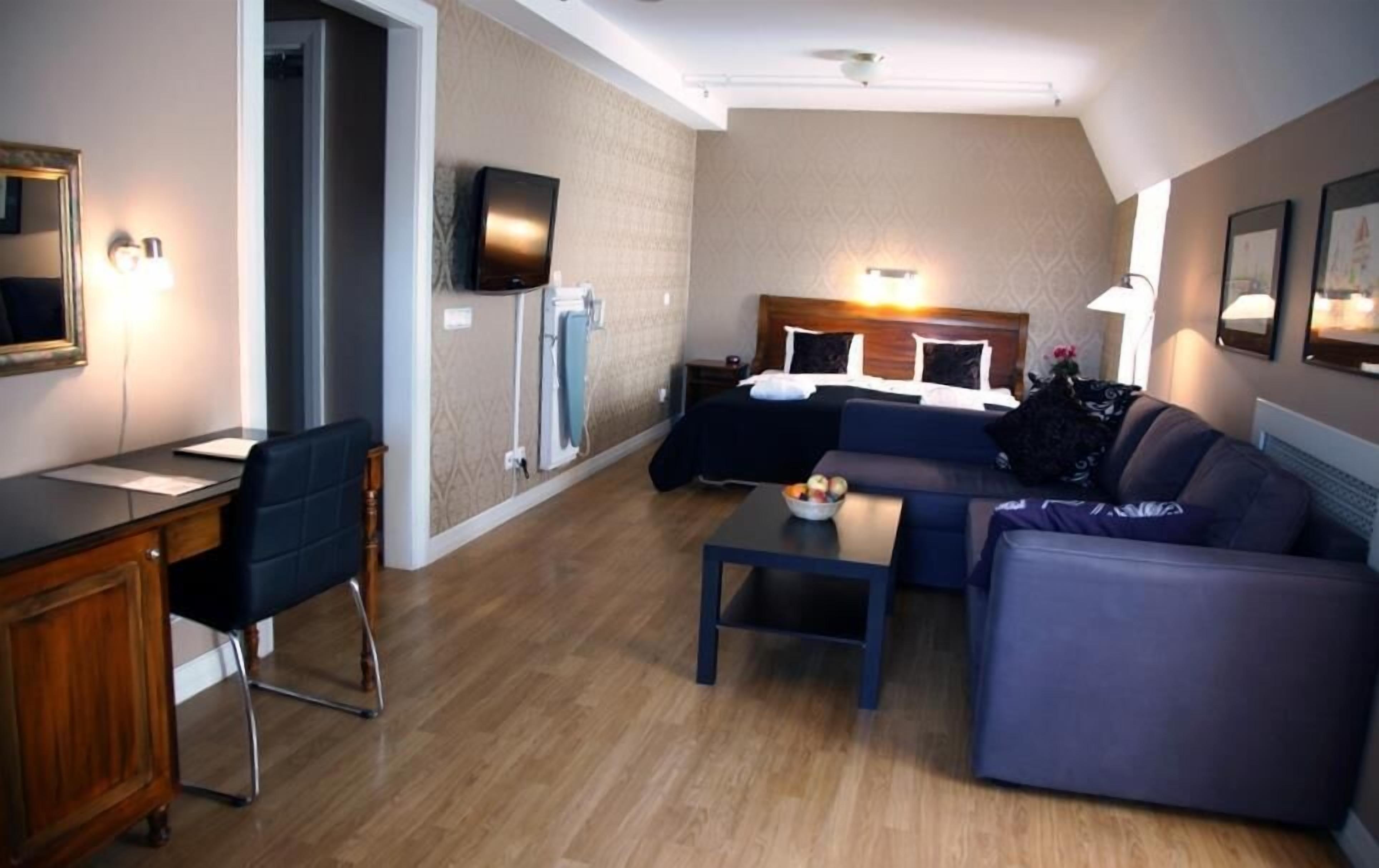 desk, blackout curtains, iron/ironing board, free cots/infant beds