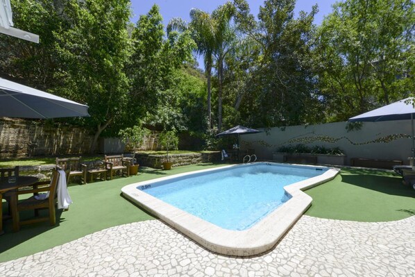 Indoor pool, outdoor pool, open 7 AM to 9 PM, pool umbrellas