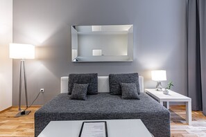 Family Apartment | Living area | 55-inch Smart TV with satellite channels, TV, Netflix